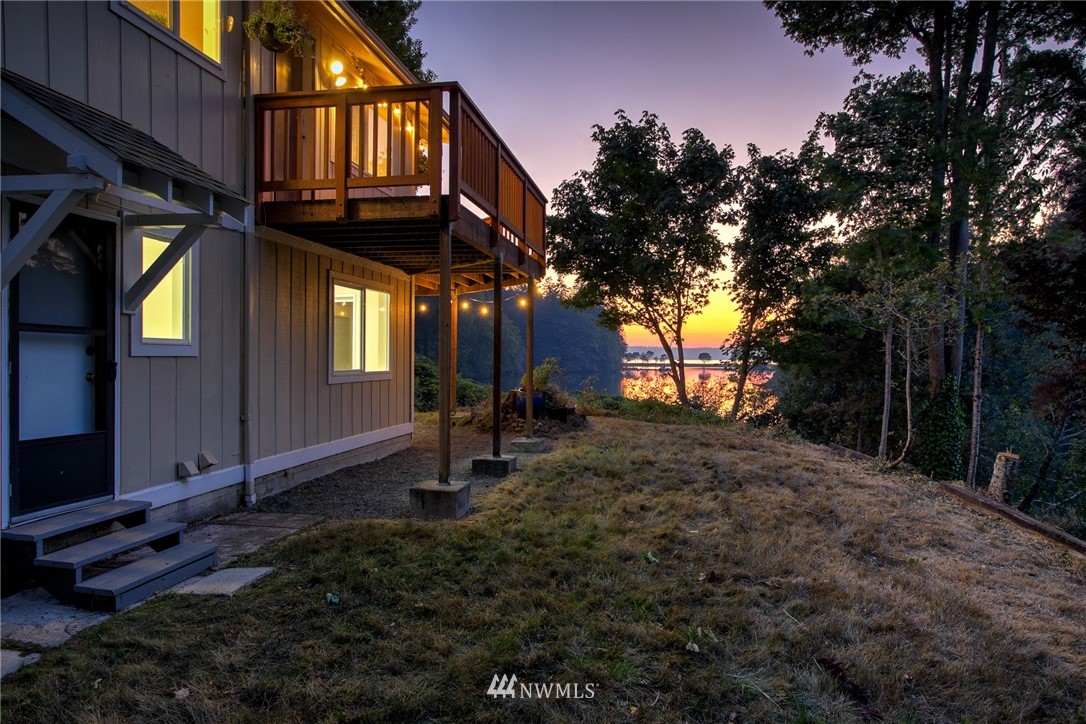 19605 Whiteman Cove Road Southwest Lakebay, WA 98351 - Photo 28 of 40 a backyard of a house with lots of green space