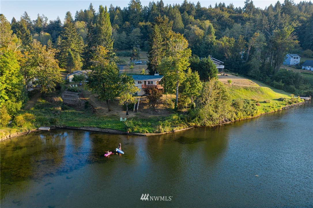 19605 Whiteman Cove Road Southwest Lakebay, WA 98351 - Photo 32 of 40 an aerial view of a house with swimming pool and outdoor space