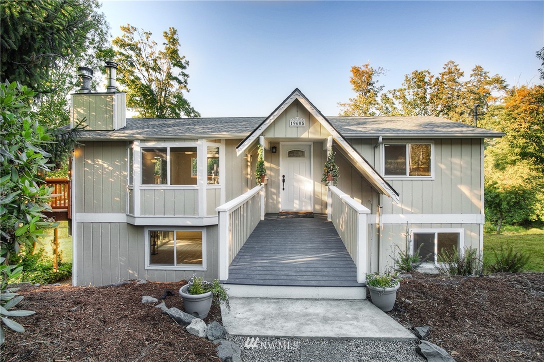 19605 Whiteman Cove Road Southwest Lakebay, WA 98351 - Photo 5 of 40 a front view of a house with garden