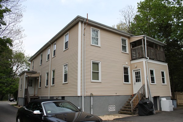 153 Spring Street Bridgewater, MA 02324 - Photo 1 of 5 a front view of a house with a yard