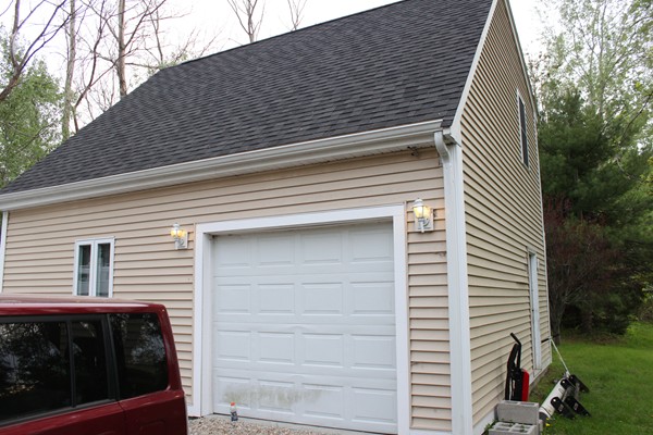 153 Spring Street Bridgewater, MA 02324 - Photo 2 of 5 a front view of a house with garage