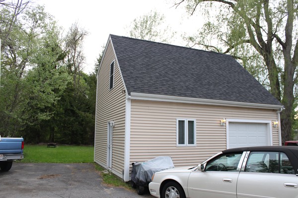 153 Spring Street Bridgewater, MA 02324 - Photo 3 of 5 a view of a house with a yard