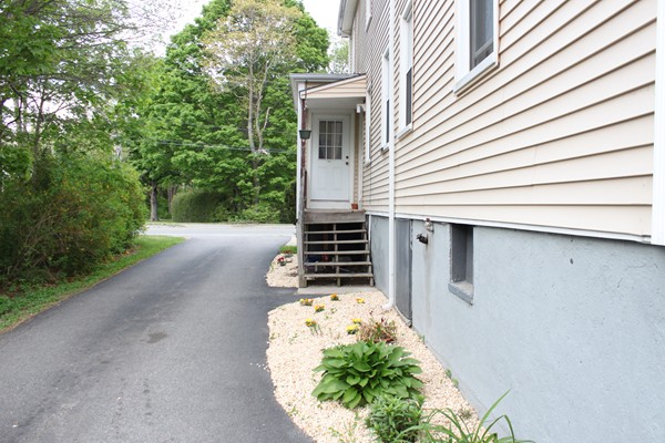 153 Spring Street Bridgewater, MA 02324 - Photo 4 of 5 a front view of a house with a yard