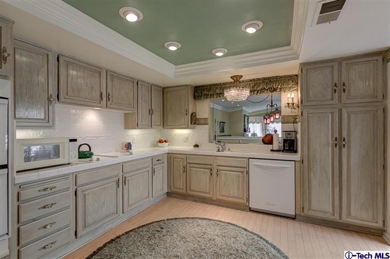 2031 Rosemont Avenue, Unit 2 Pasadena, CA 91103 - Photo 13 of 33 a kitchen with white cabinets and sink