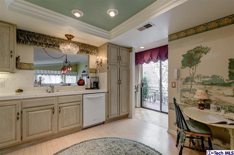 2031 Rosemont Avenue, Unit 2 Pasadena, CA 91103 - Photo 15 of 33 a kitchen with a sink refrigerator and cabinets