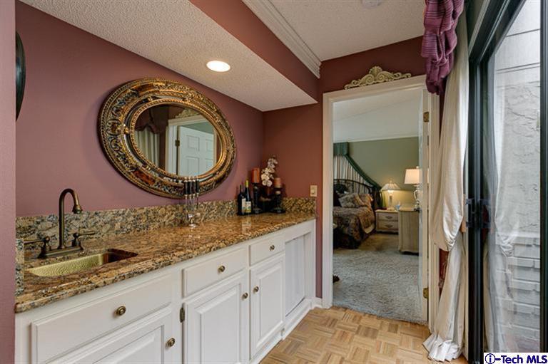 2031 Rosemont Avenue, Unit 2 Pasadena, CA 91103 - Photo 17 of 33 a spacious bathroom with a granite countertop sink and a mirror