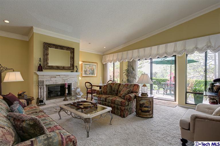 2031 Rosemont Avenue, Unit 2 Pasadena, CA 91103 - Photo 9 of 33 a living room with furniture a large window and a fireplace