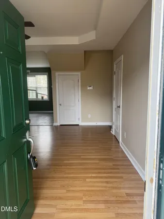 a view of room with window and hardwood floor
