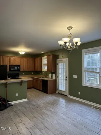 a view of a kitchen with a sink and dishwasher