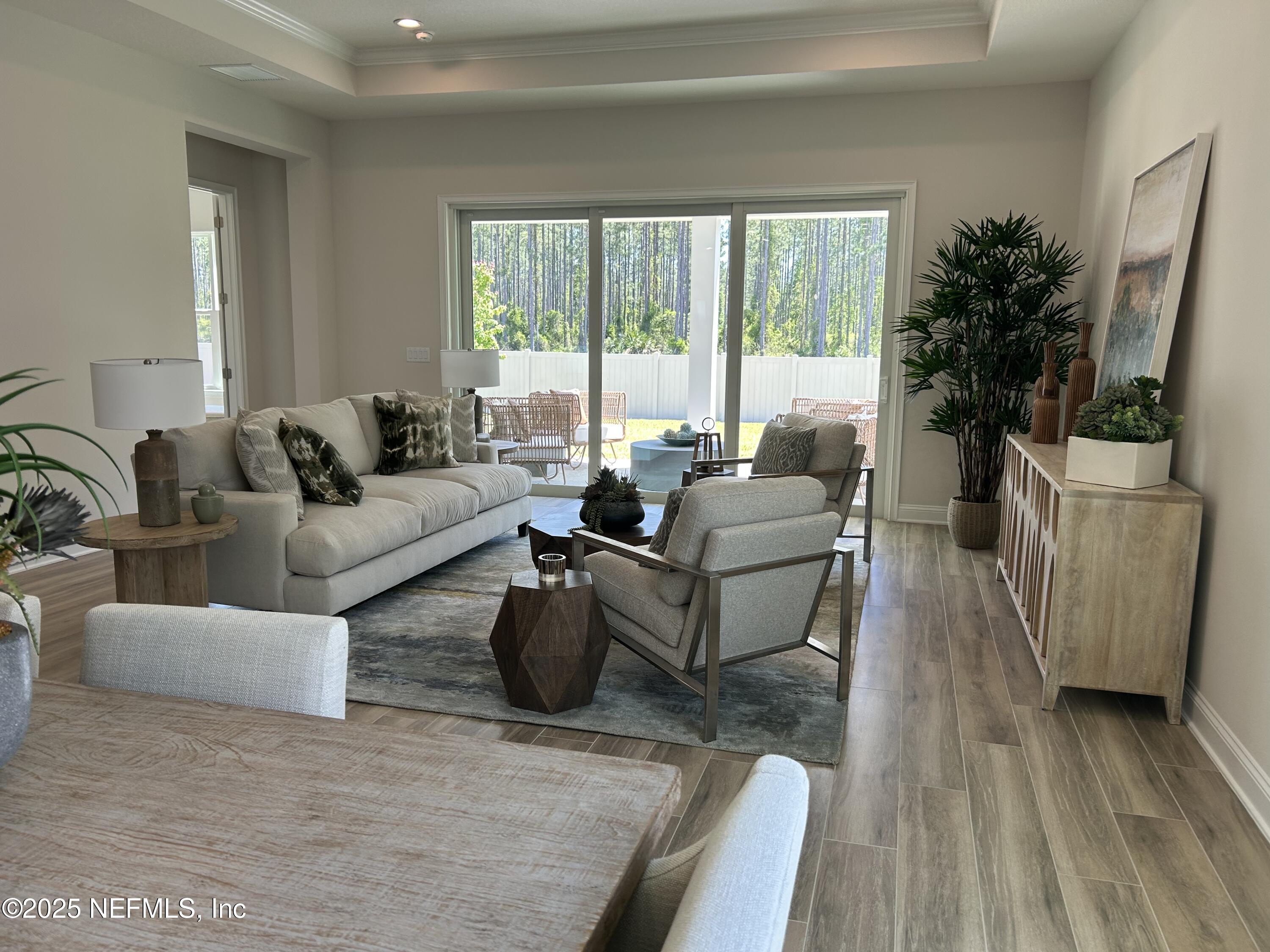 486 Navigators Road St. Johns, FL 32259 - Photo 12 of 22 a living room with furniture and a large window