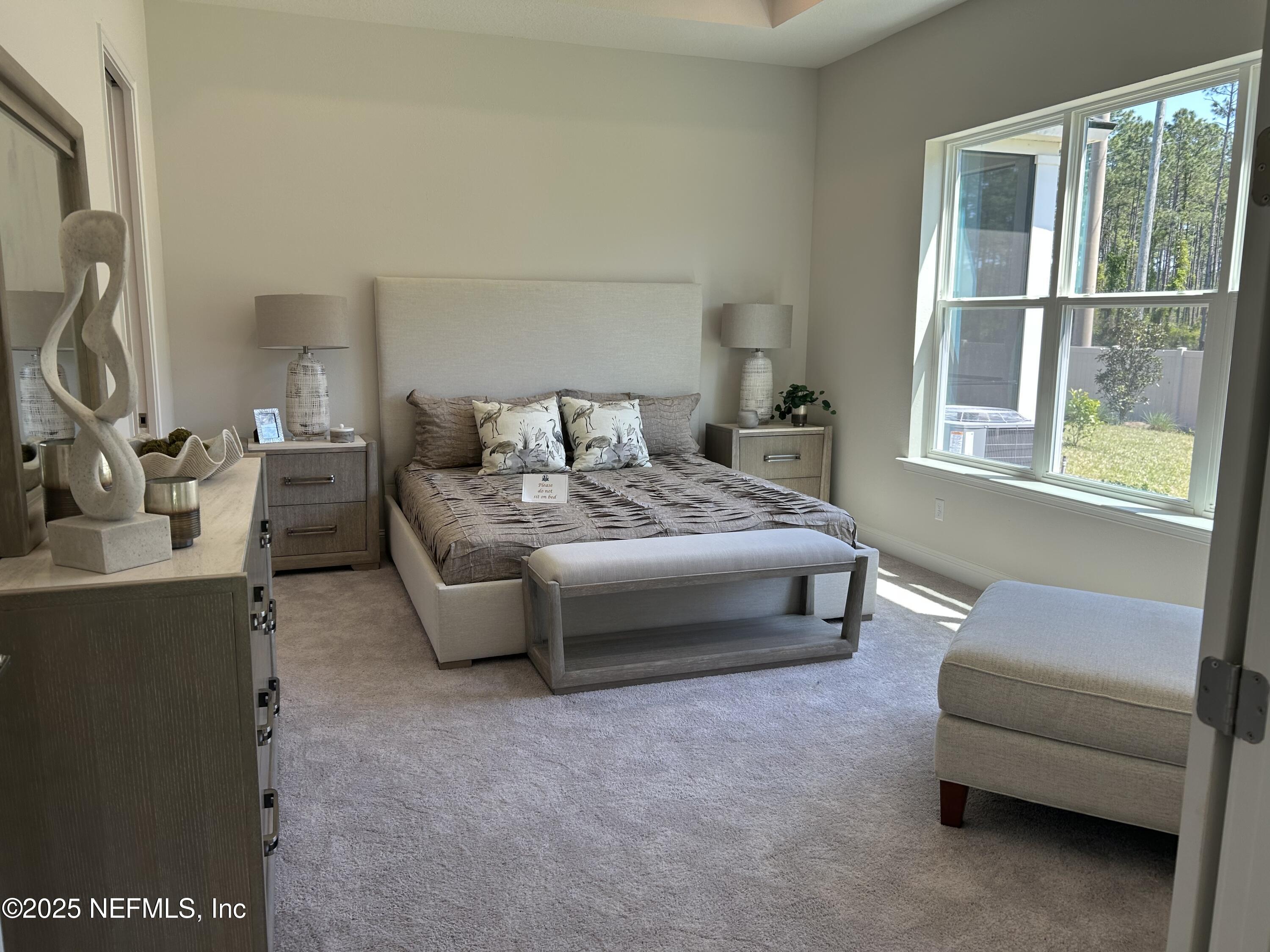 486 Navigators Road St. Johns, FL 32259 - Photo 14 of 22 a bedroom with a bed and a window