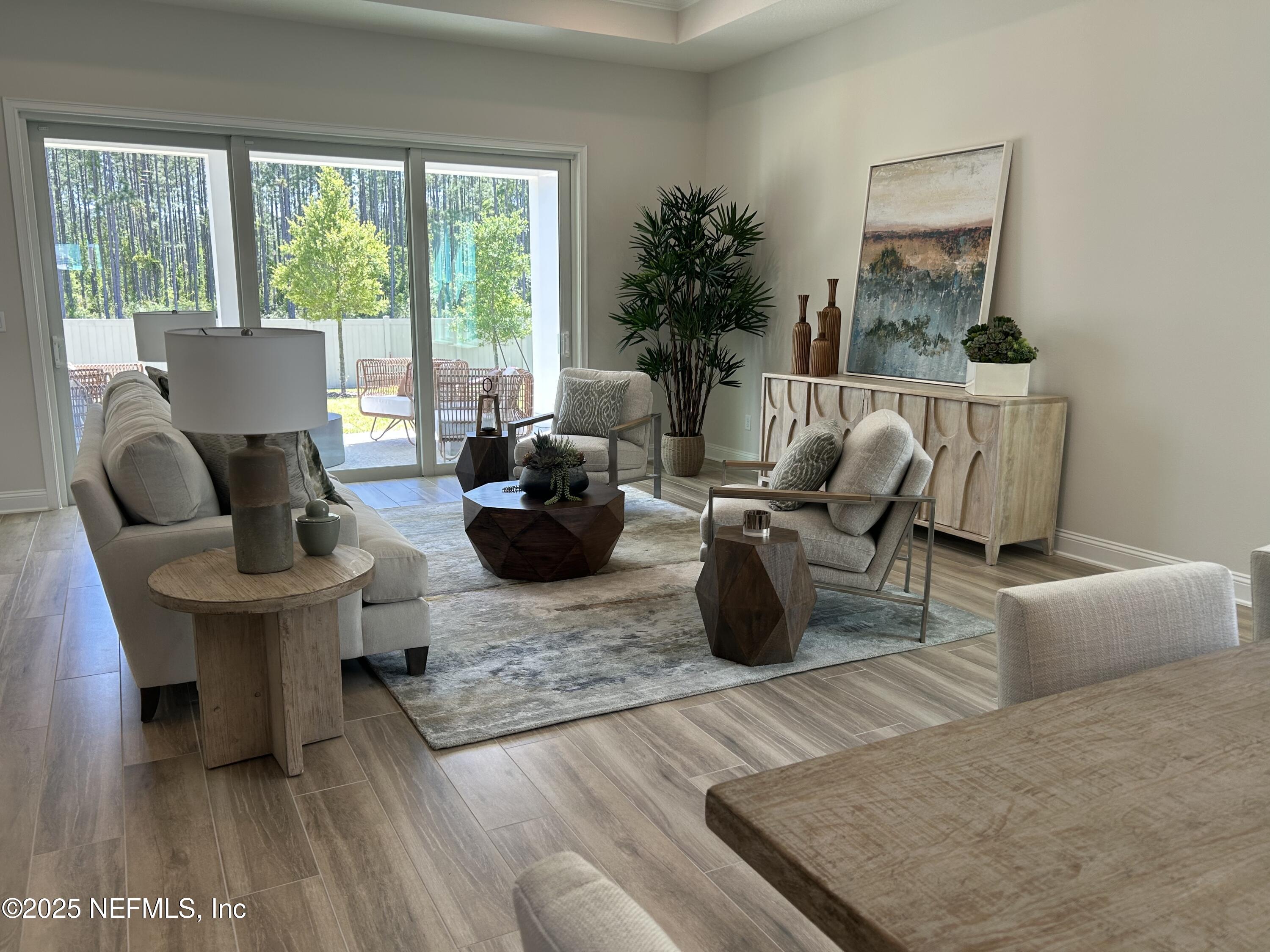 486 Navigators Road St. Johns, FL 32259 - Photo 20 of 22 a living room with furniture and a large window