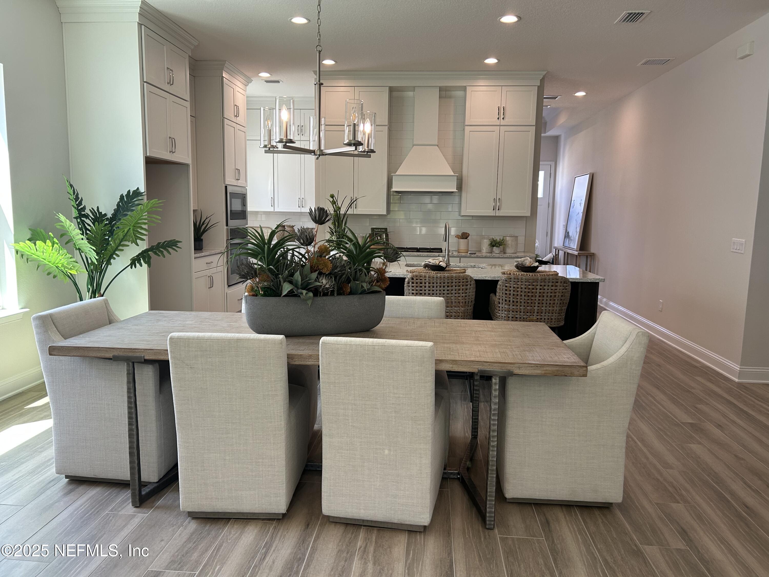 486 Navigators Road St. Johns, FL 32259 - Photo 21 of 22 a kitchen with a table and chairs