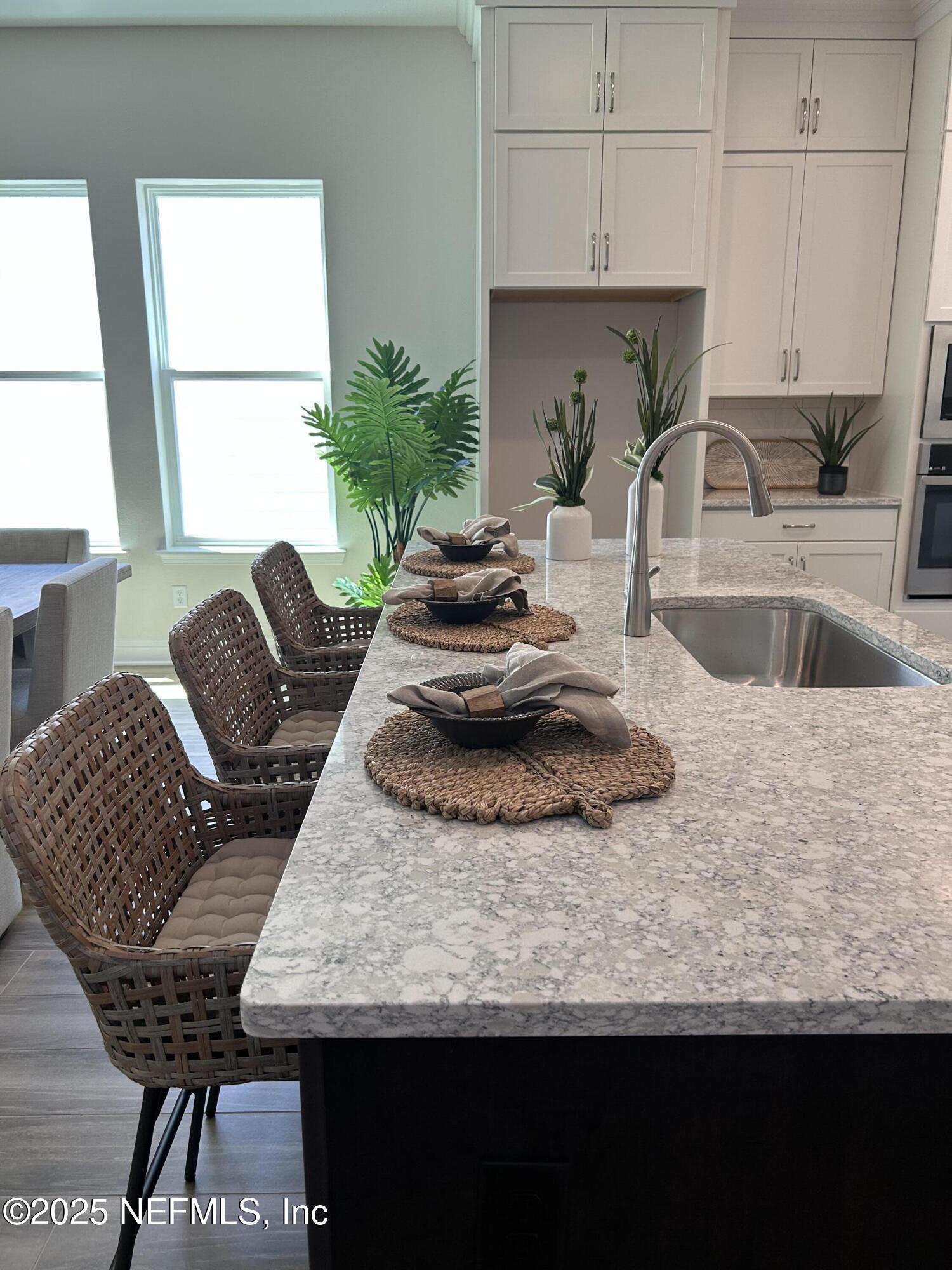 486 Navigators Road St. Johns, FL 32259 - Photo 6 of 22 a kitchen with granite countertop lots of counter top space