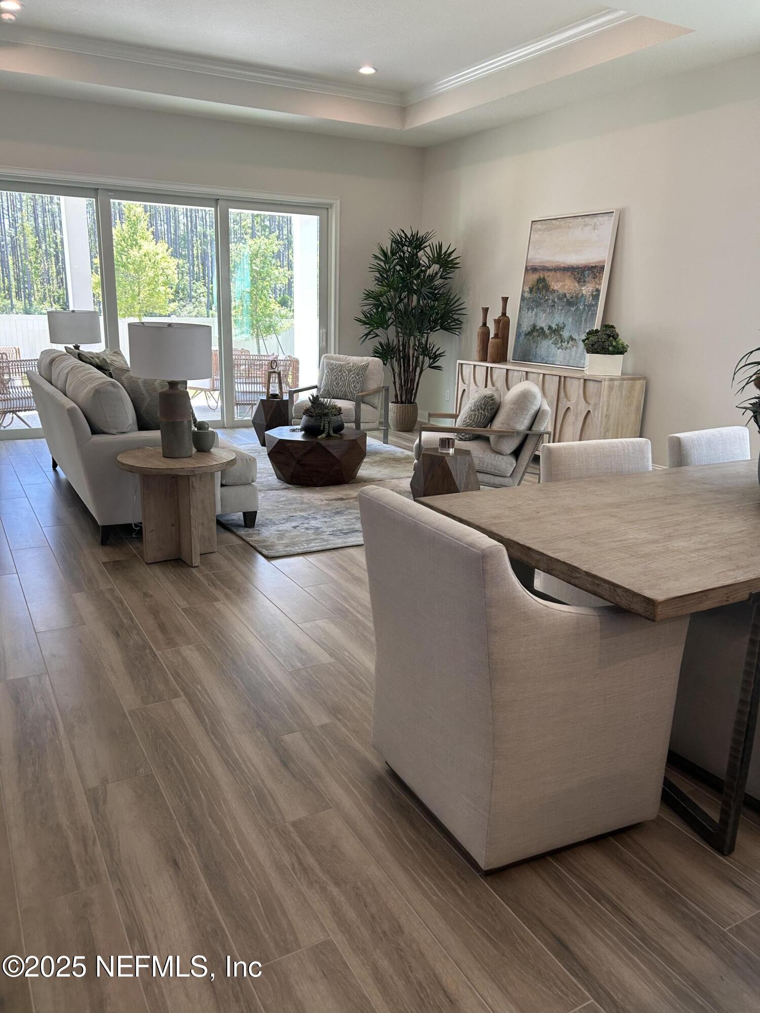 486 Navigators Road St. Johns, FL 32259 - Photo 9 of 22 a living room with furniture and a large window