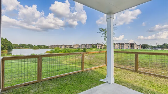a bathroom with a tub sink toilet and mirror