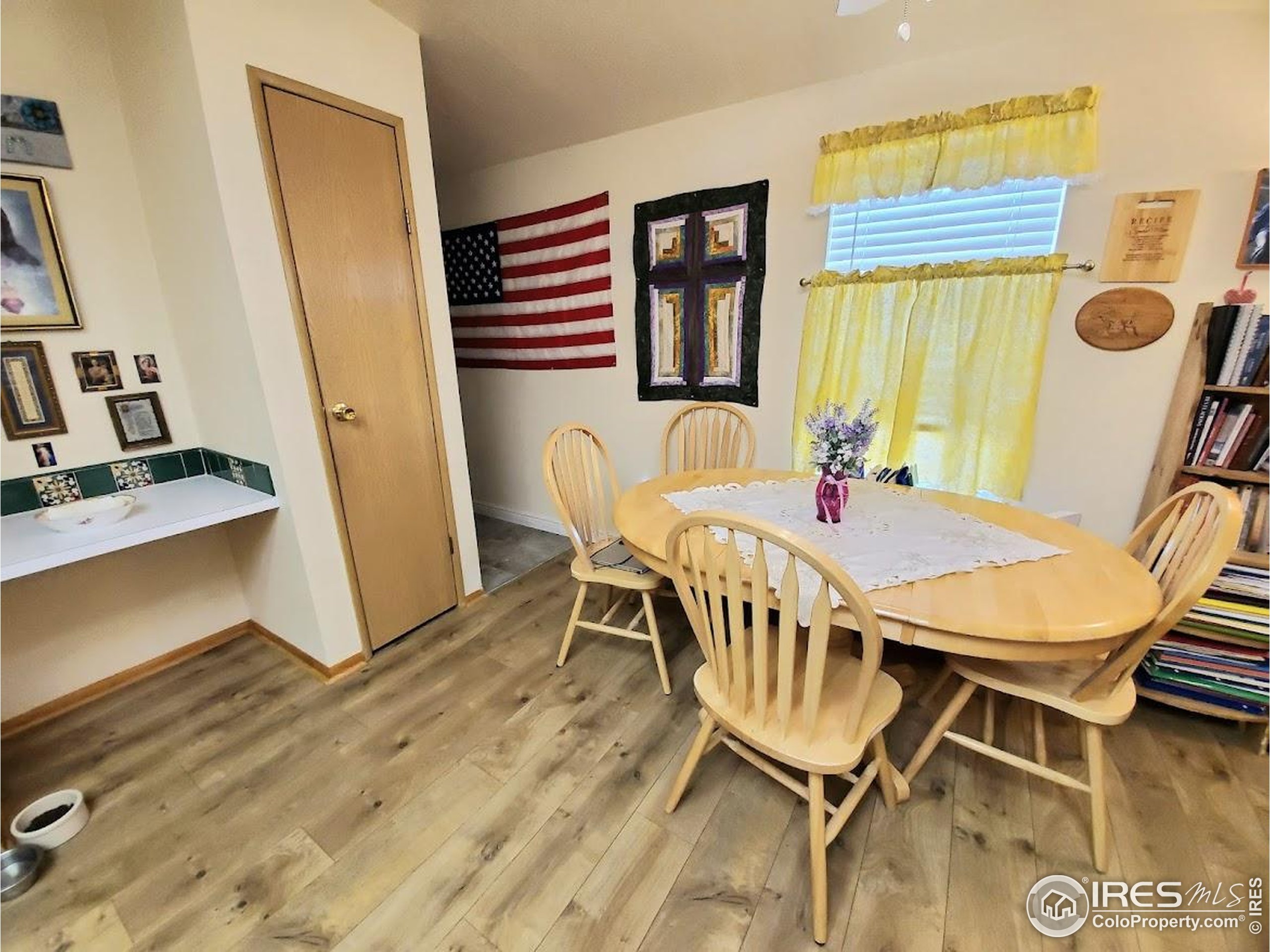 605 West 57th Street, Unit 42 Loveland, CO 80538 - Photo 11 of 38 a dining room with furniture and window