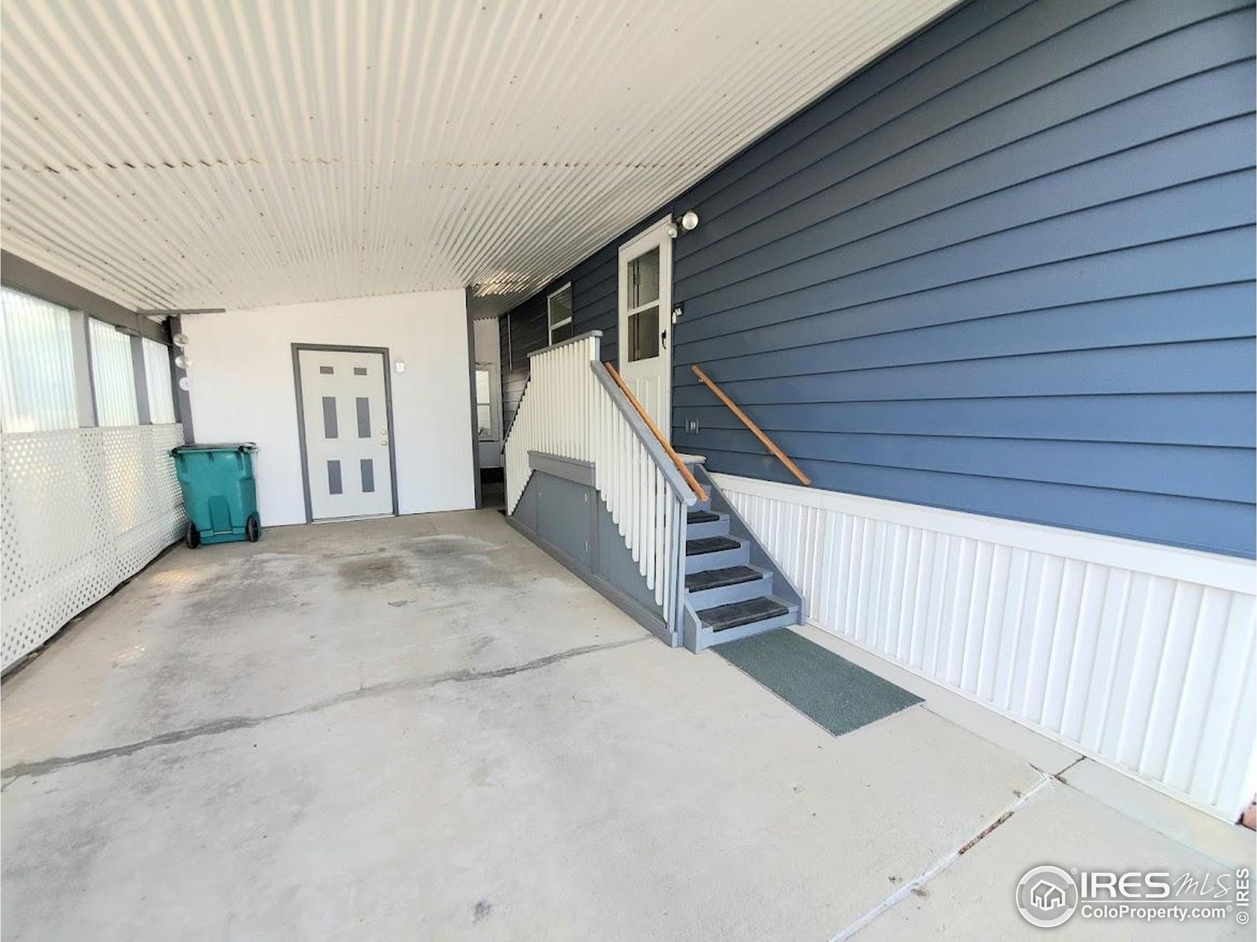 605 West 57th Street, Unit 42 Loveland, CO 80538 - Photo 2 of 38 a view of a house with stairs and a white door