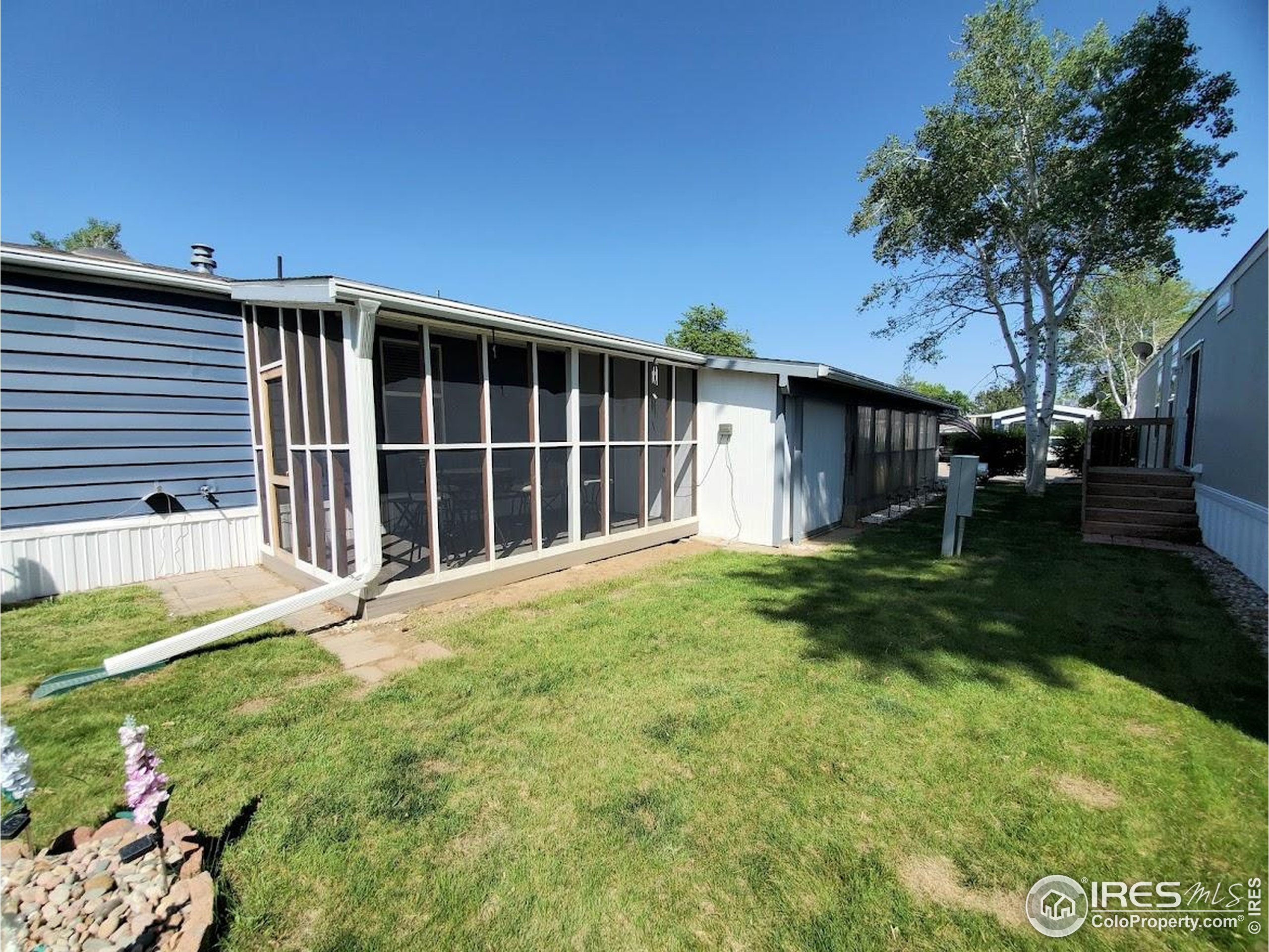 605 West 57th Street, Unit 42 Loveland, CO 80538 - Photo 26 of 38 a house view with a garden space