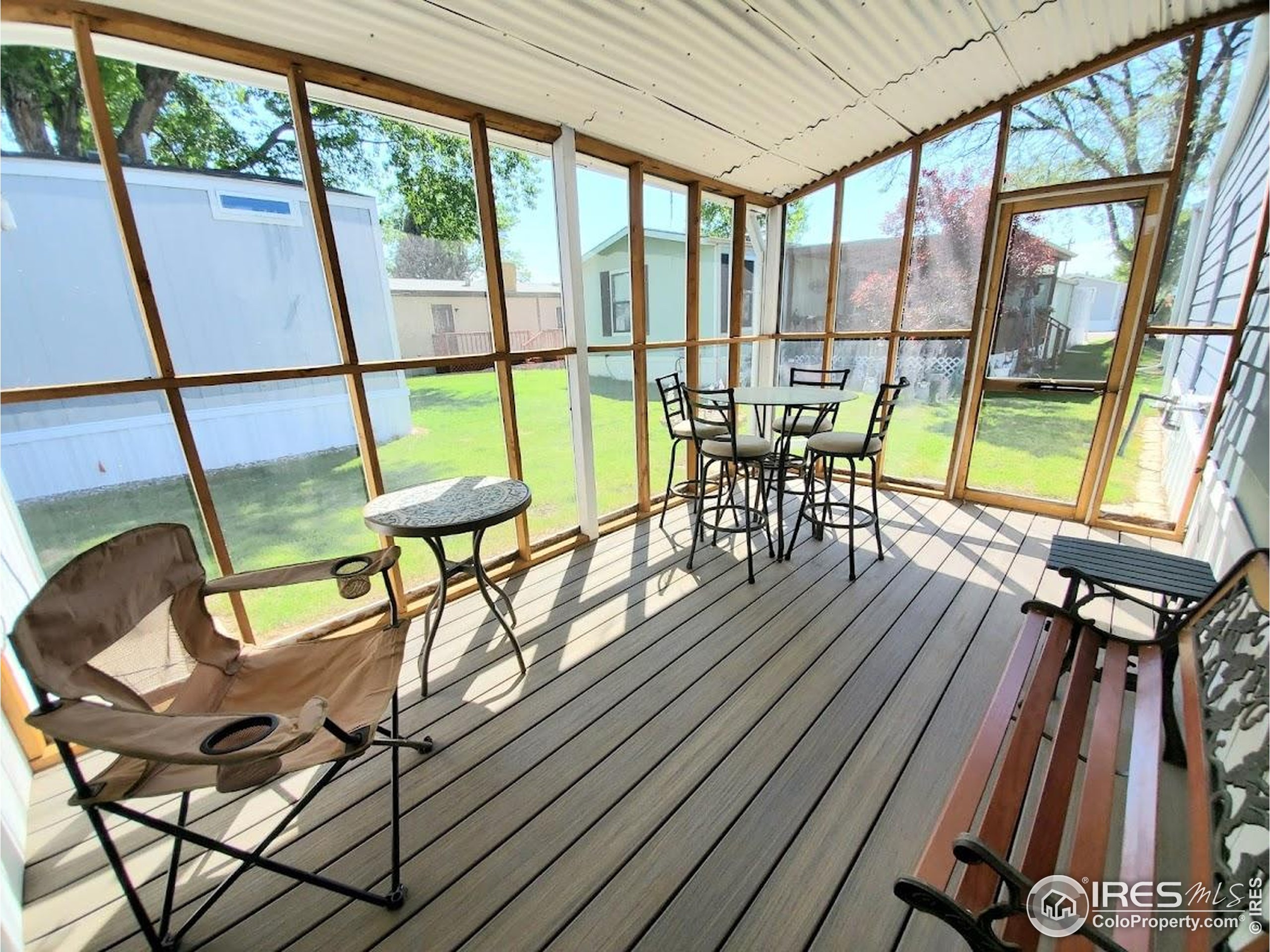 605 West 57th Street, Unit 42 Loveland, CO 80538 - Photo 29 of 38 a view of a dining room with furniture window and wooden floor