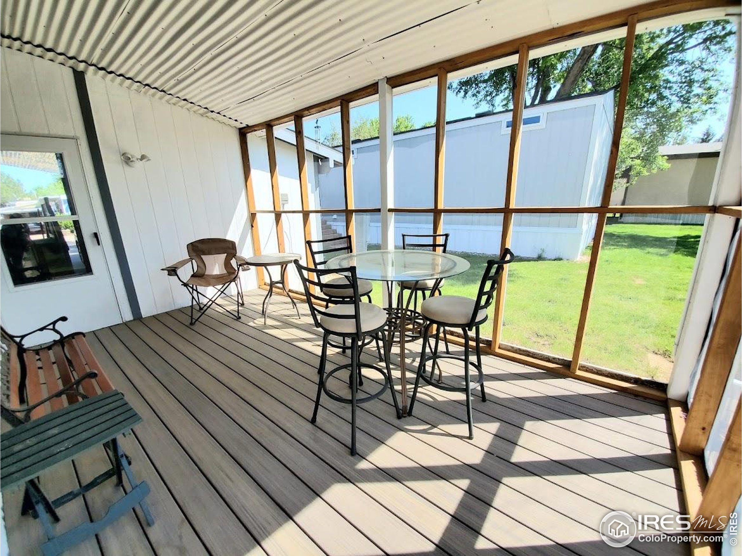 605 West 57th Street, Unit 42 Loveland, CO 80538 - Photo 30 of 38 a view of a chairs and table in the balcony
