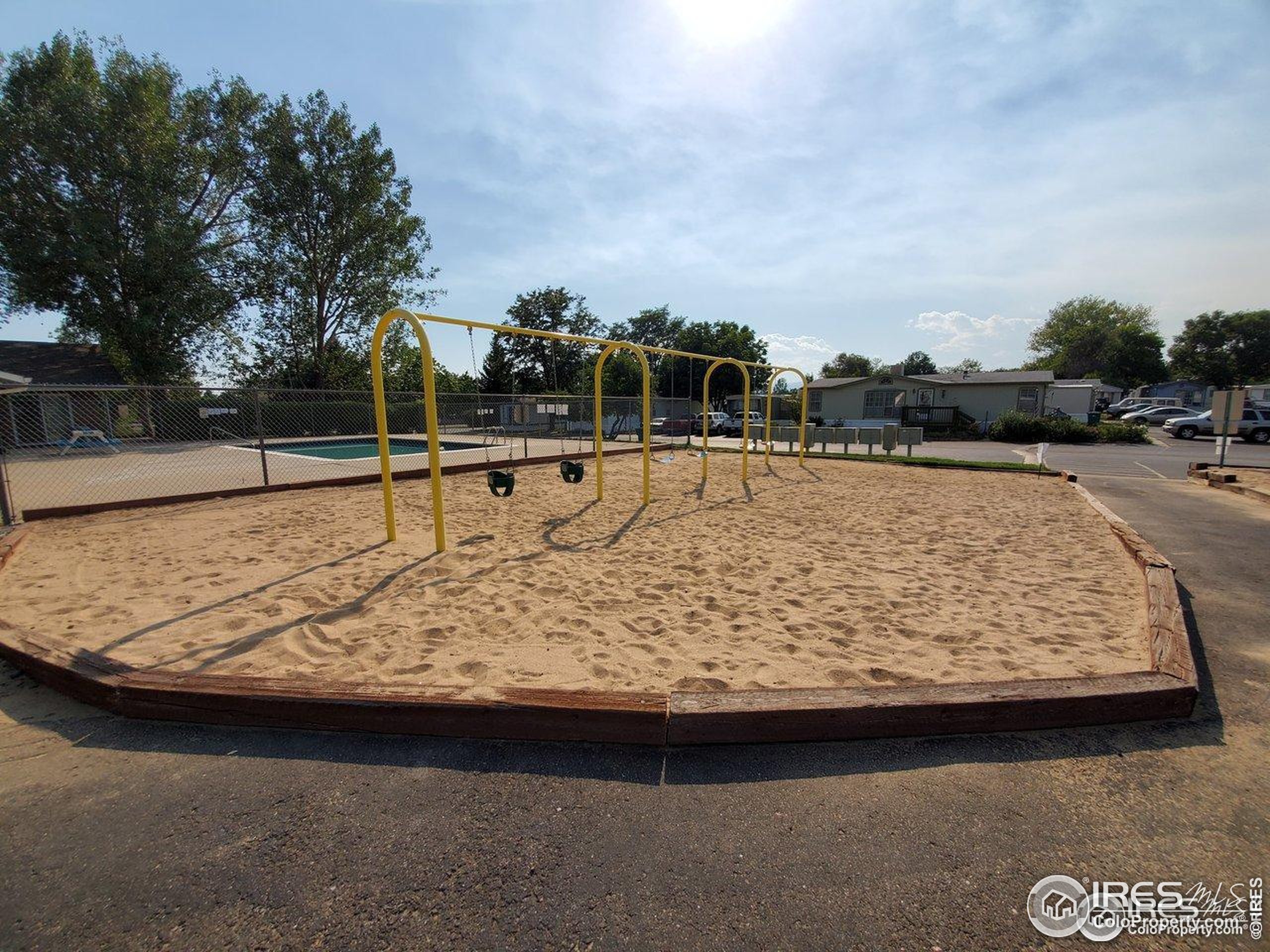 605 West 57th Street, Unit 42 Loveland, CO 80538 - Photo 37 of 38 a view of swimming pool with a yard