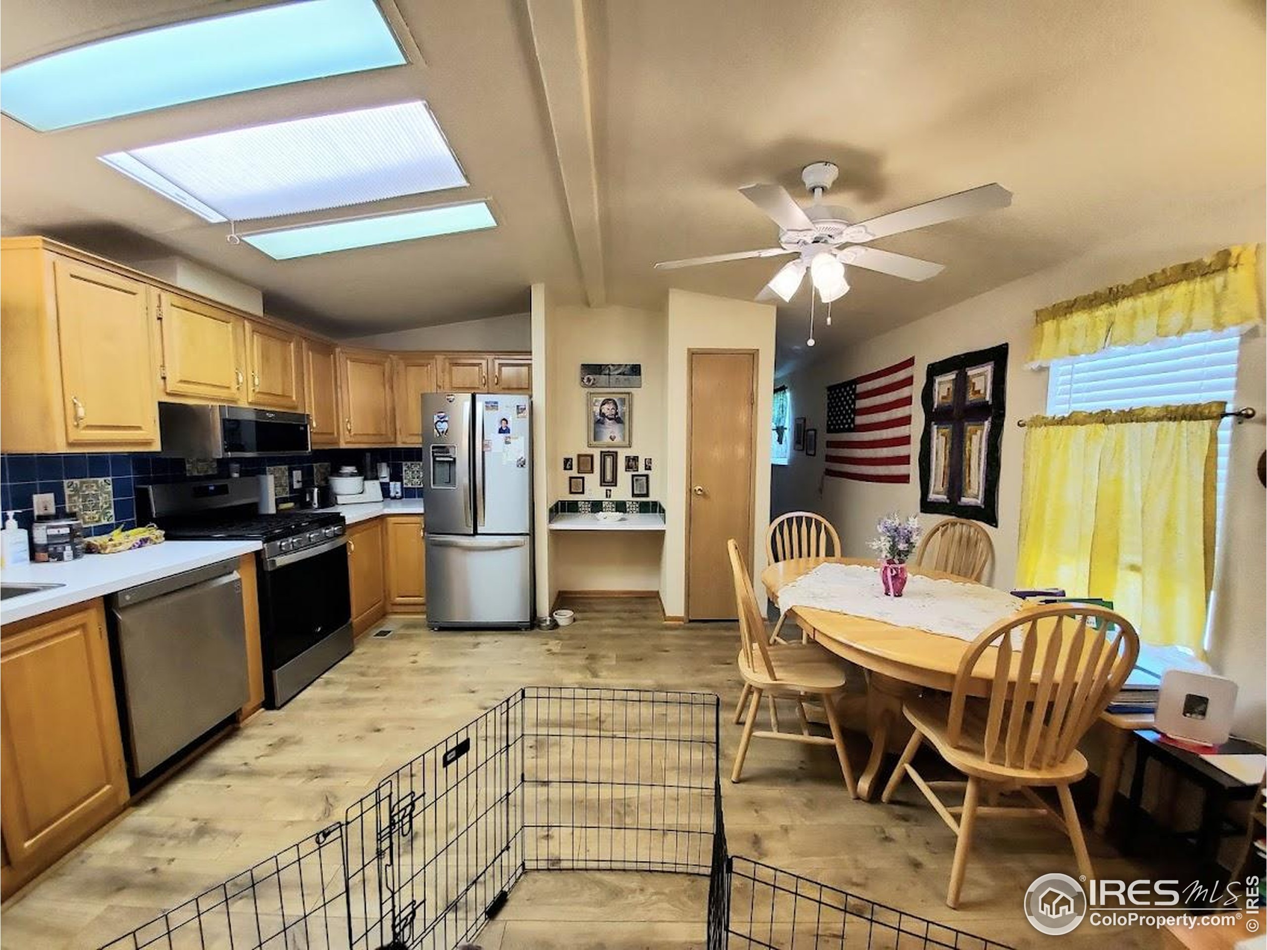 605 West 57th Street, Unit 42 Loveland, CO 80538 - Photo 6 of 38 a kitchen with granite countertop lots of counter top space and stainless steel appliances
