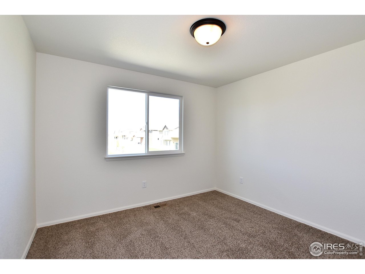 2270 Sublime Drive Windsor, CO 80550 - Photo 32 of 39 an empty room with a window