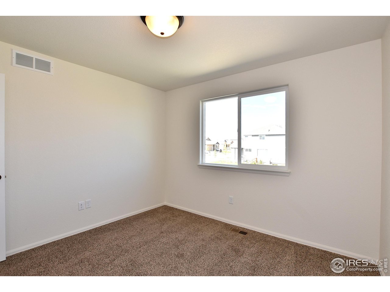 2270 Sublime Drive Windsor, CO 80550 - Photo 34 of 39 an empty room with windows