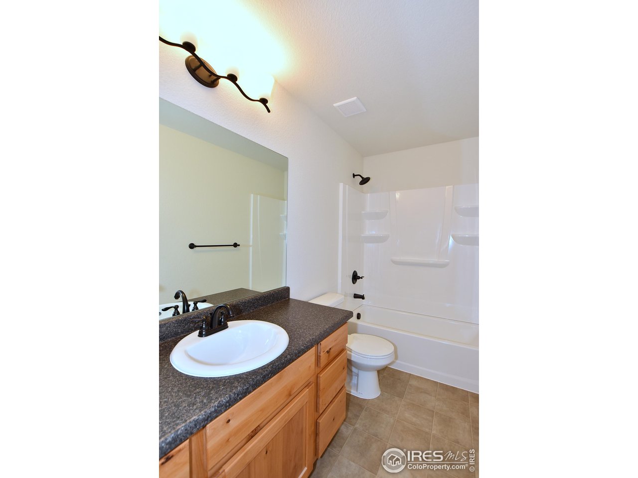 2270 Sublime Drive Windsor, CO 80550 - Photo 36 of 39 a bathroom with a sink and a mirror