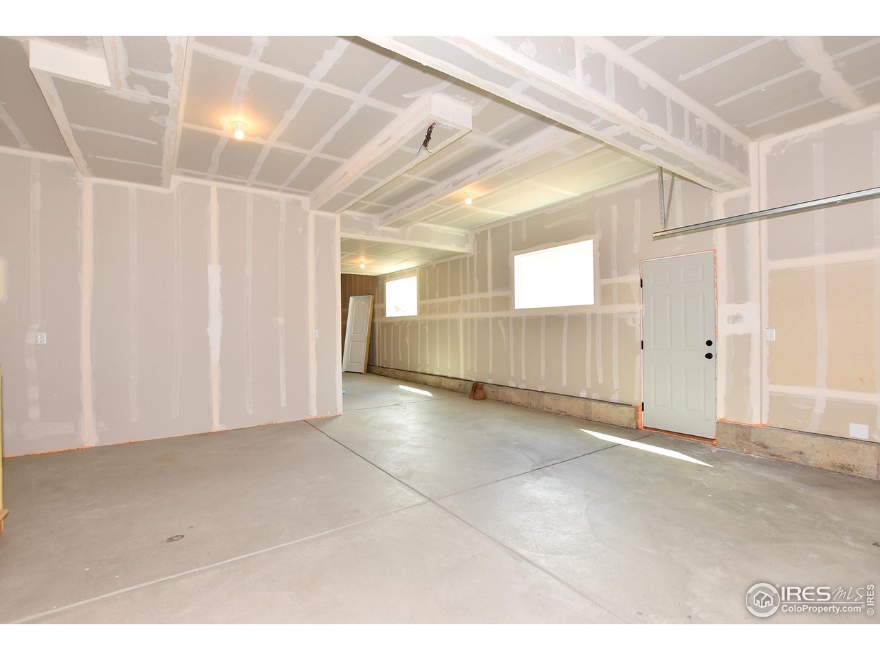 2270 Sublime Drive Windsor, CO 80550 - Photo 37 of 39 a view of a hallway with wooden floor