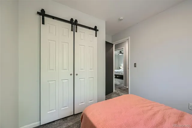 a bedroom with a bed and a shower