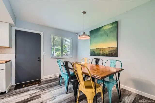 a view of a dining room with furniture window and wooden floor