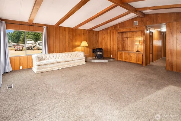 a view of an empty room with a fireplace