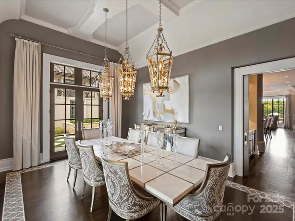 a kitchen with stainless steel appliances granite countertop a lot of counter space and wooden floors