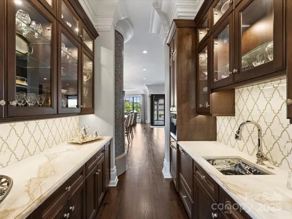 a large kitchen with a table and chairs