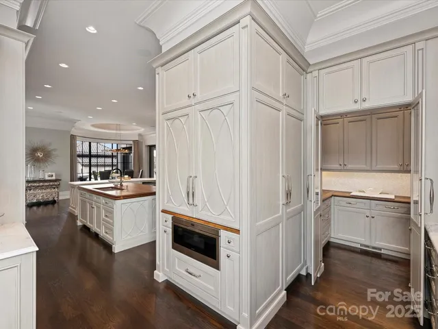 a bathroom with a double vanity sink and a window