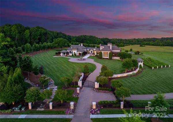 a view of a big yard with houses and outdoor space