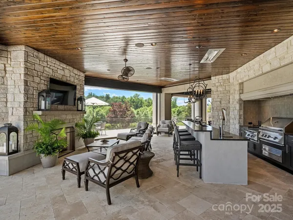 a view of a house with couches table and chairs