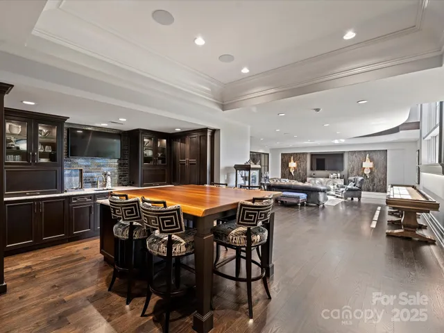 a view of a livingroom with furniture window and a ceiling fan