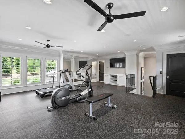 a kitchen with stainless steel appliances granite countertop a dining table chairs and granite counter tops