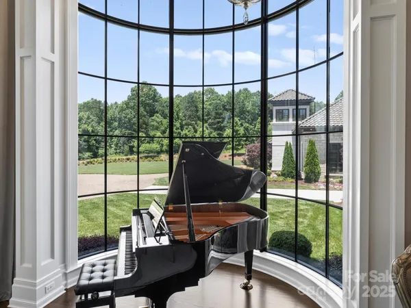 a room with gym equipment and a large window