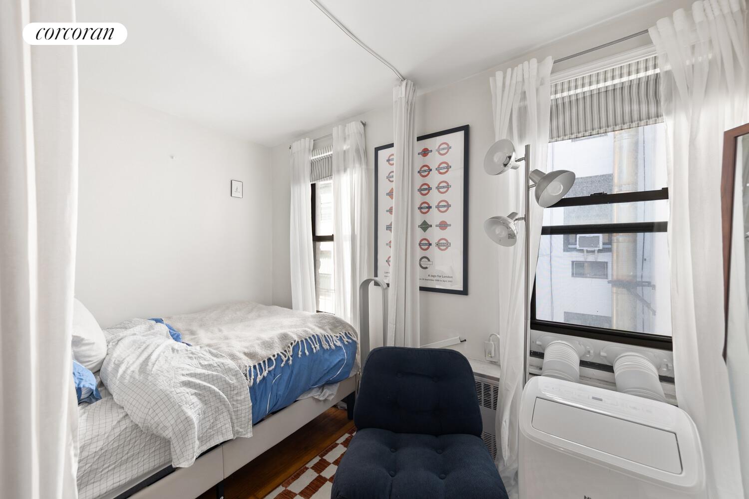 238 East 30th Street, Unit 3E Manhattan, NY 10016 - Photo 3 of 5 a bedroom with a bed couch and a window