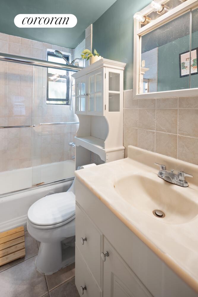 238 East 30th Street, Unit 3E Manhattan, NY 10016 - Photo 5 of 5 a bathroom with a sink toilet and shower