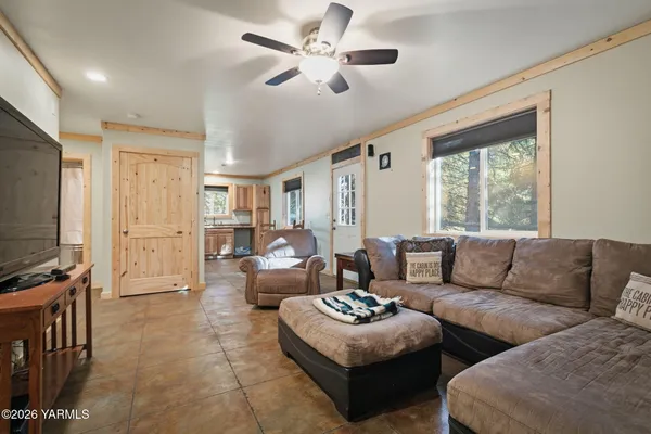 a kitchen with stainless steel appliances white cabinets and a refrigerator