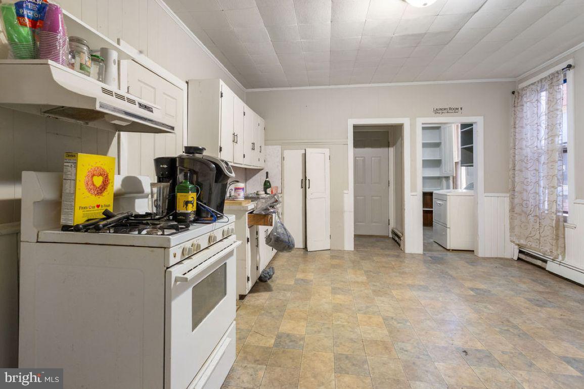 138 Pleasant Street Hanover, PA 17331 - Photo 22 of 39 a kitchen with stainless steel appliances a stove refrigerator and a sink