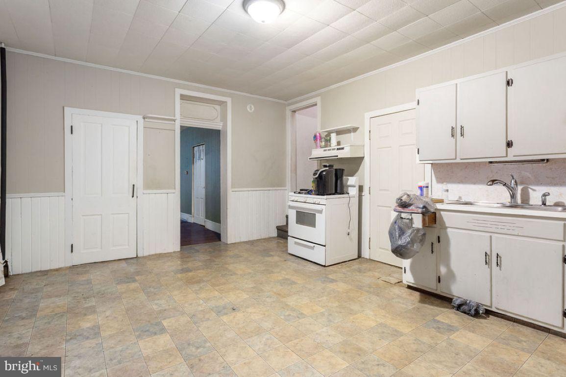 138 Pleasant Street Hanover, PA 17331 - Photo 23 of 39 a room with white cabinets and white appliances
