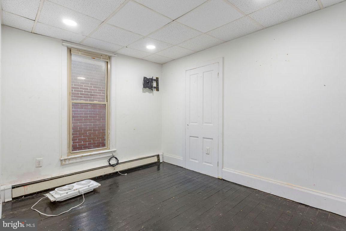 138 Pleasant Street Hanover, PA 17331 - Photo 28 of 39 an empty room with wooden floor and windows