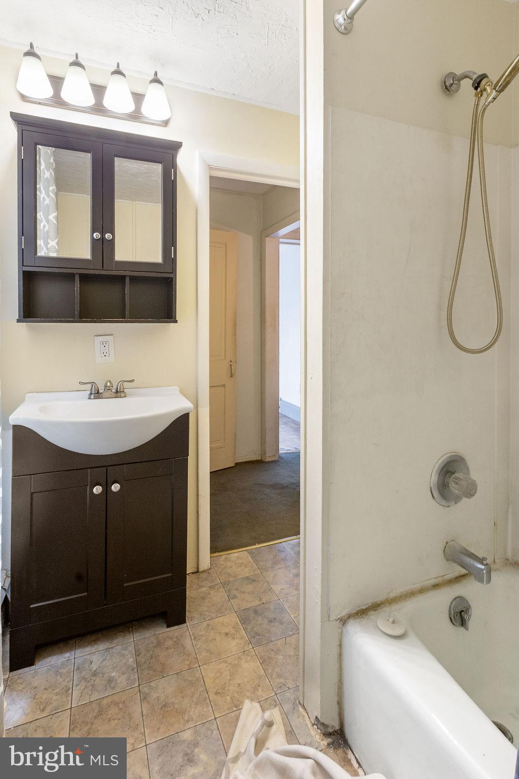138 Pleasant Street Hanover, PA 17331 - Photo 31 of 39 a bathroom with a sink vanity and mirror