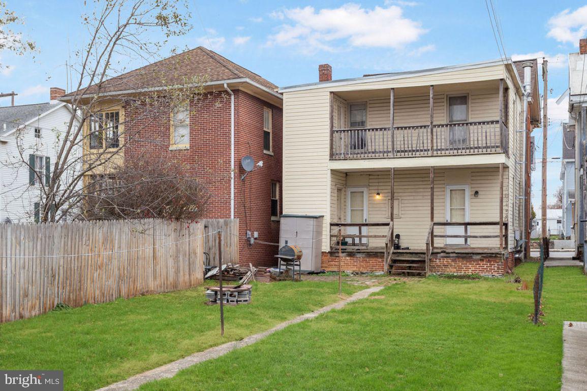 138 Pleasant Street Hanover, PA 17331 - Photo 37 of 39 a front view of a house with a garden and chairs